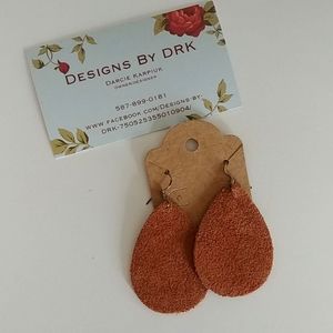 Suede earring with silver backing.